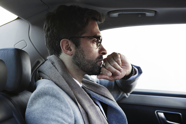 Man in spectacles sitting in car   - Foto, Imagem