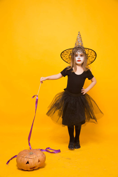 Small girl in Halloween witch costume - Zdjęcie, obraz