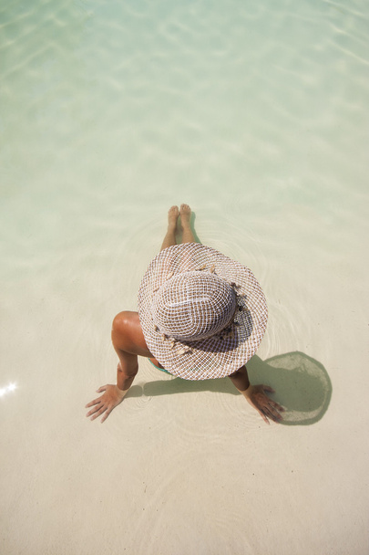 Woman enjoying a swimming pool - Фото, изображение