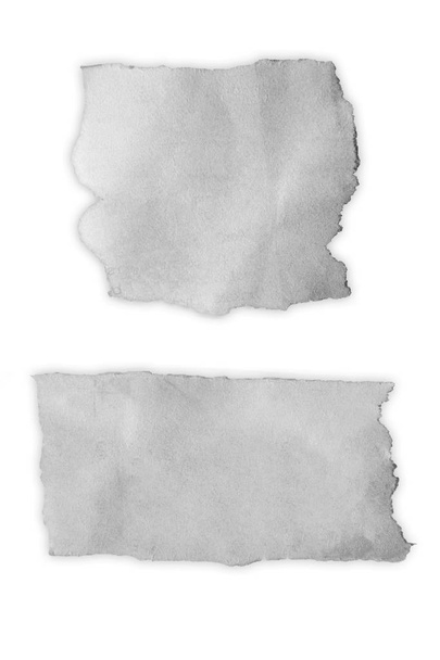 Dos pedazos de papel desgarrado
 - Foto, Imagen