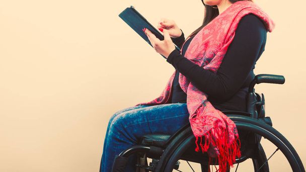 Disabled student with tablet ebook. - Valokuva, kuva