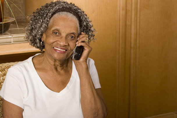 Portrait of an elderly African American woman at home. - 写真・画像