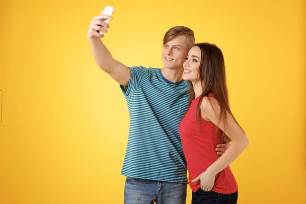 Happy young couple taking selfie  - Фото, изображение