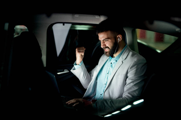 Businessman working in car - Photo, Image