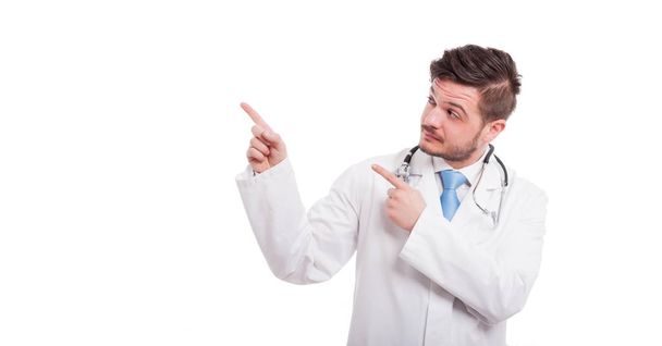Doctor or medic pointing up with index finger - Fotó, kép