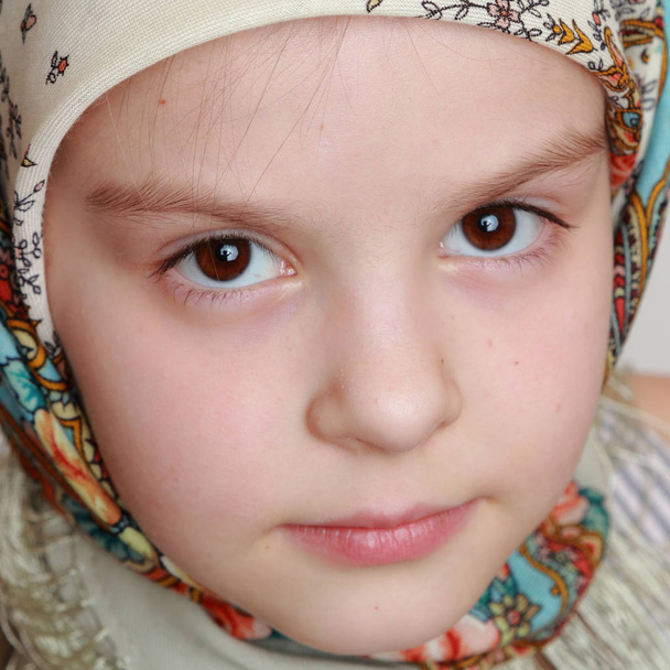 russian little girl in traditional skarf  - Fotó, kép