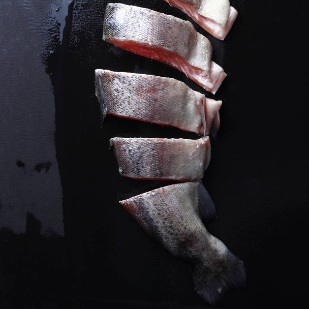 Studio image of trout over black background - Foto, imagen