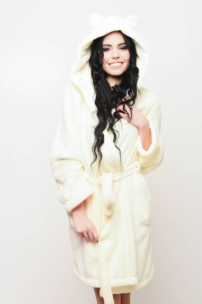 sexy smiling girl posing in beige velour bathrobe - Zdjęcie, obraz