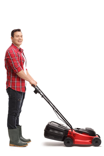 portrait of a gardener with a lawnmower - Foto, afbeelding