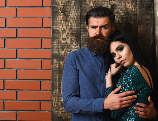 bearded man and pretty sexy woman on brick wood background - Zdjęcie, obraz