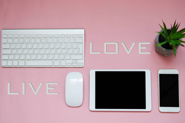 white devices on pink background with love live sign. mock up - Fotoğraf, Görsel