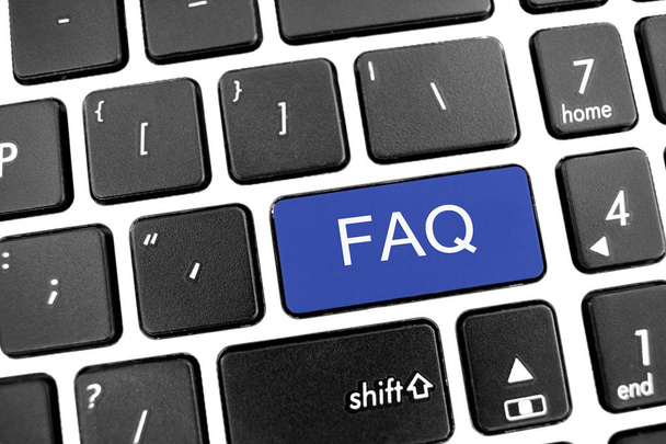 Teclado moderno negro plano de un ordenador portátil con botón azul: FAQ
 - Foto, Imagen
