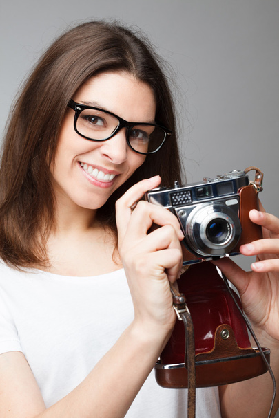Retro photographer girl holding camera - Foto, imagen