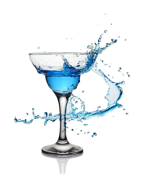 Splash in glass of a blue alcoholic cocktail drink - Φωτογραφία, εικόνα