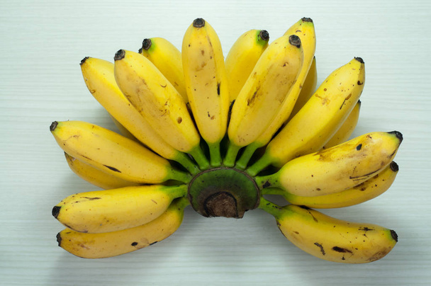 bananas on a wooden table white - Photo, Image