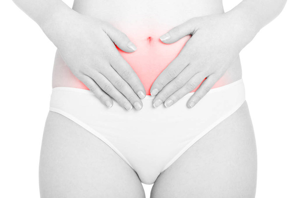 Woman regularity, hands on abdomen, red pain area isolated on white background - Foto, Imagem