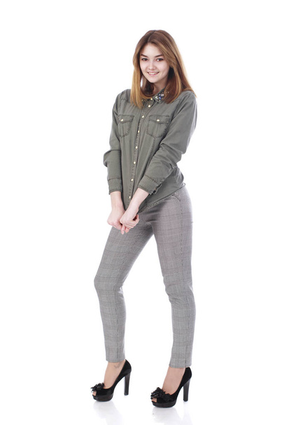 Young beautiful blonde woman in gray trousers - Photo, image