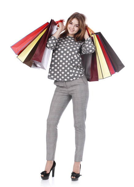 Young brunette woman with some shopping bags  - Fotoğraf, Görsel