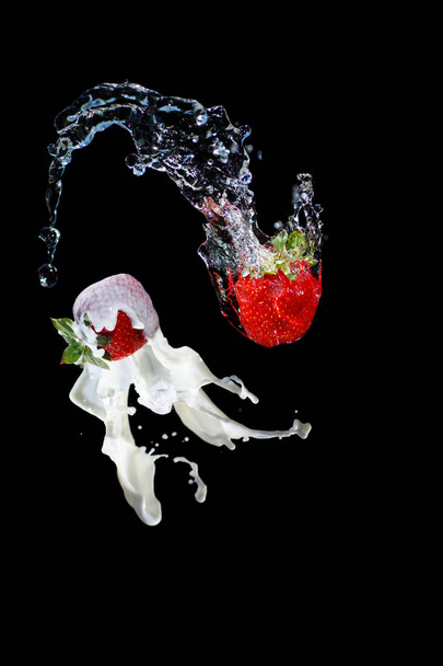 Strawberry with milk water splash black background - Foto, Imagen