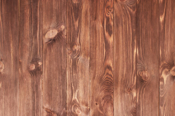Dark brown scratched wooden cutting board. Wood texture - Фото, изображение