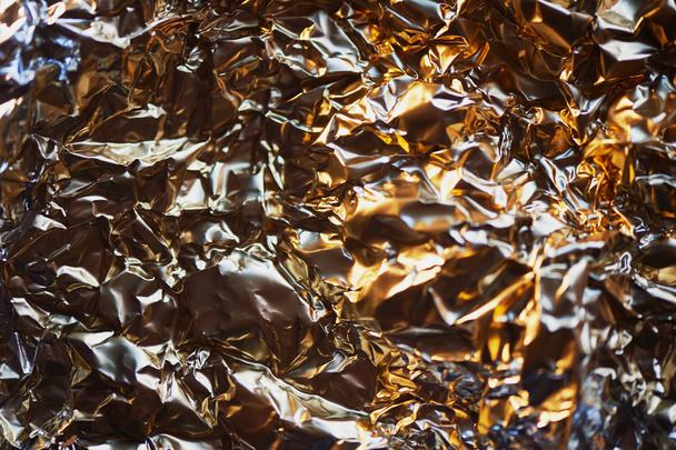 Aluminum foil texture. Glide view. Gold - Fotoğraf, Görsel