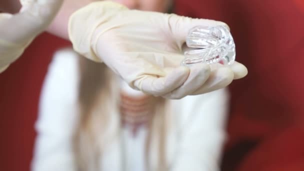 Dentist holds syringe with gel for cleaning teeth - Metraje, vídeo