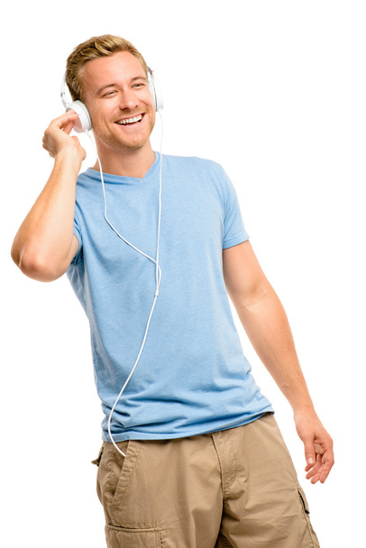Attractive young man wearing headphones on white background - Foto, Imagem