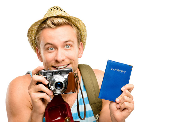 Happy young tourist man holding passport retro camera white back - Φωτογραφία, εικόνα