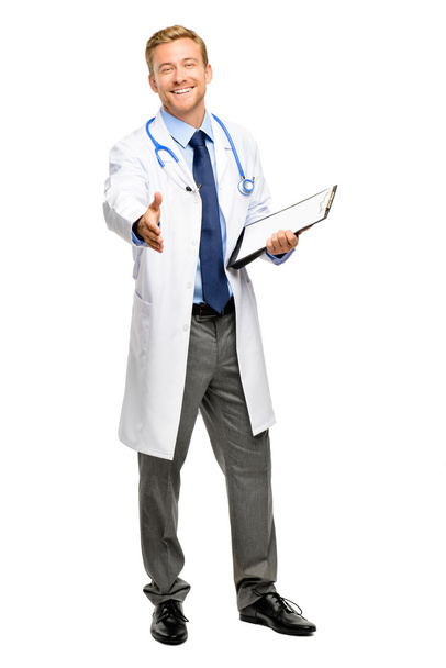 Full length of confident young doctor on white background - 写真・画像