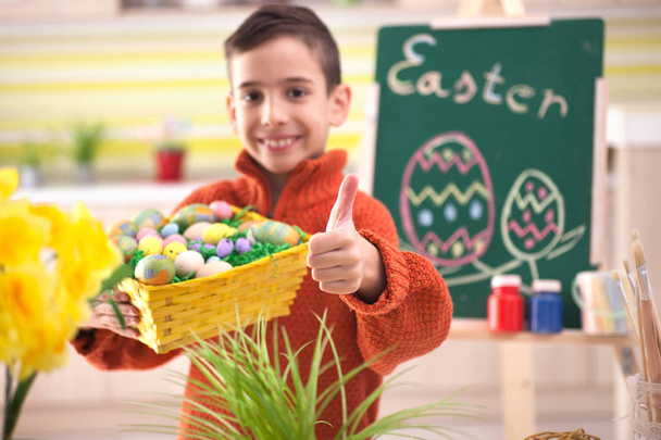 Cute little child boy preparing for Easter  - Foto, imagen