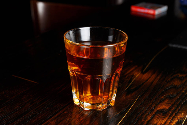 Faceted glass of brandy - Foto, imagen