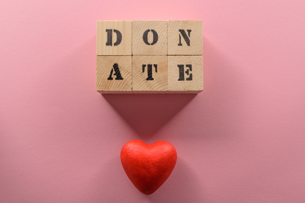 Word donate and heart symbol  - Photo, Image