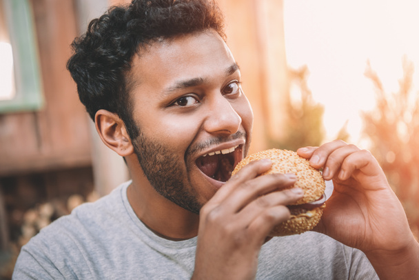 Man eating hamburger  - Photo, Image