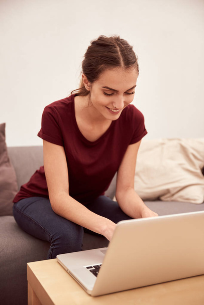young woman typing on laptop   - Фото, зображення
