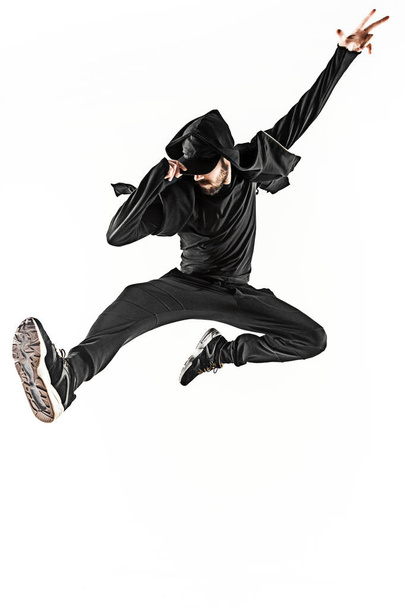 The silhouette of one hip hop male break dancer dancing on white background - Foto, imagen