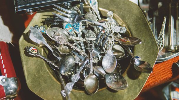 vintage sterling silver spoon. Flea markets of Europe and vintage household items. Silver spoons and knives. Shallow focus  - Foto, Imagen