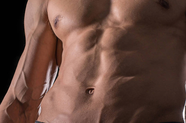 Close up perfect abs. Sexy muscular male torso six packs. - Zdjęcie, obraz