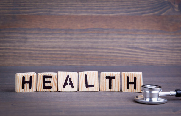 Health from wooden letters. Abstract business and success background - Foto, afbeelding