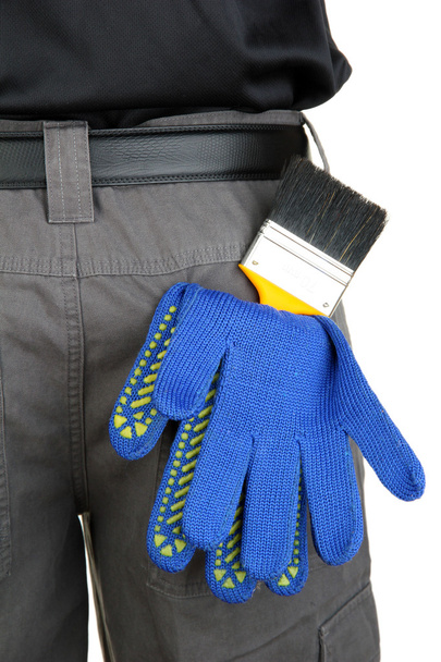 brush and gloves in back pocket close-up - Фото, зображення