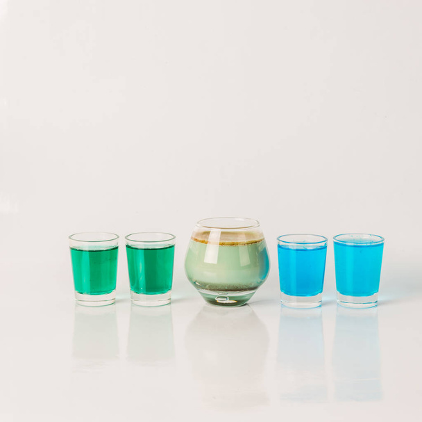 Five color drink shots, different glass shapes, blue, green and  - Valokuva, kuva