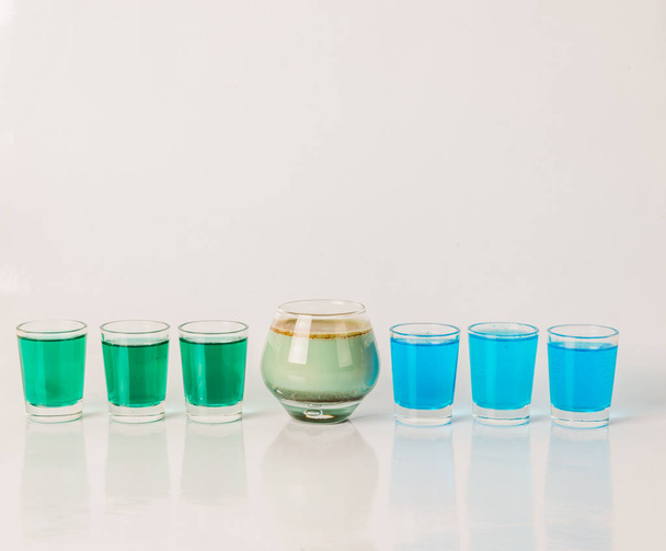 Seven color drink shots, different glass shapes, blue, green and - Photo, Image
