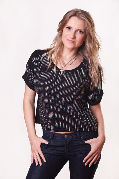 stylish woman in blouse and jeans - Fotó, kép
