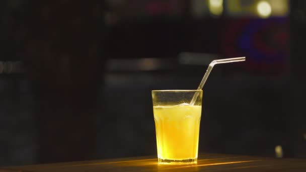 Ice coctail closeup. Rum alcohol and mango juice. - Footage, Video