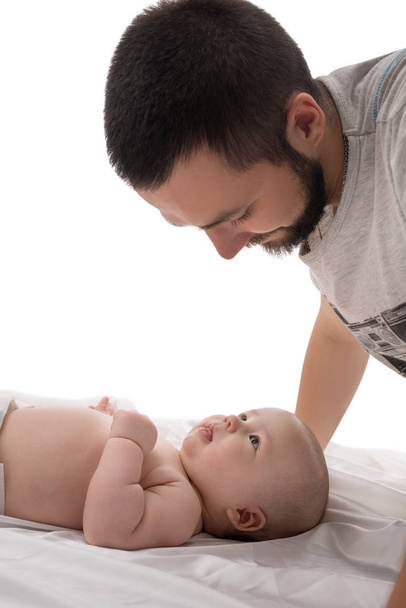 Bearded young dad with newborn in studio - Фото, зображення