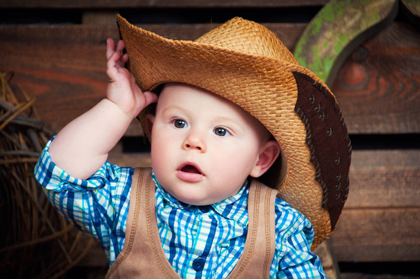 Portrait of a small boy in cowboy decor - Photo, Image