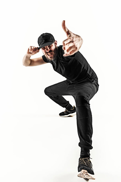 The silhouette of one hip hop male break dancer dancing on white background - Foto, immagini