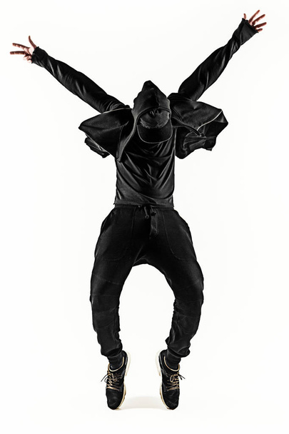 The silhouette of one hip hop male break dancer dancing on white background - Photo, image