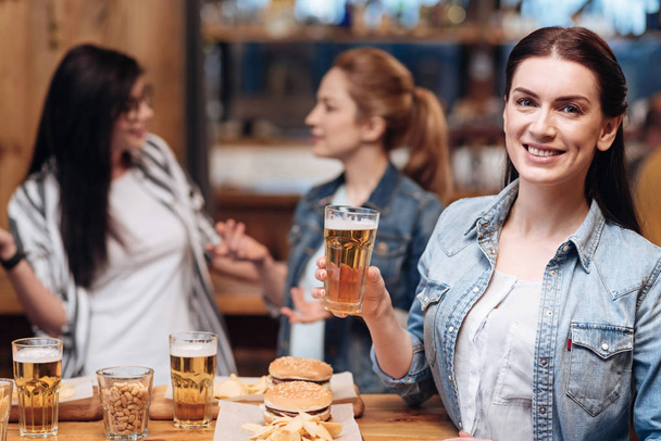 Smiling brunette posing with bocal of beer - Φωτογραφία, εικόνα