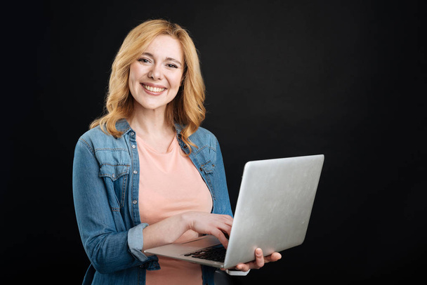 Positive delighted woman while working - Photo, Image