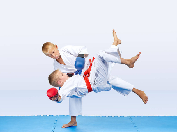 Throws of judo are training athletes with red and blue overlays on his hands - Photo, Image